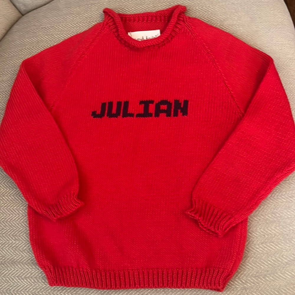Childs cotton sweater with Julian knot into the front.